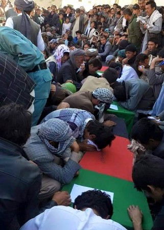 Mr. Ghani, in a statement, said “the desecration” of the bodies was a “war crime.”