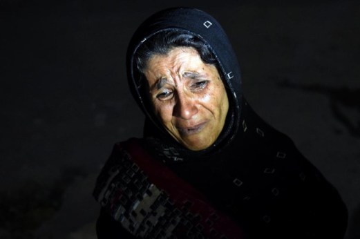 An Afghan woman cries as she looks for her son after a suicide attack at the entrance to the Police Academy in Kabul killed more than 20 cadets. (Photo: Wakil Kohsar/AFP)
